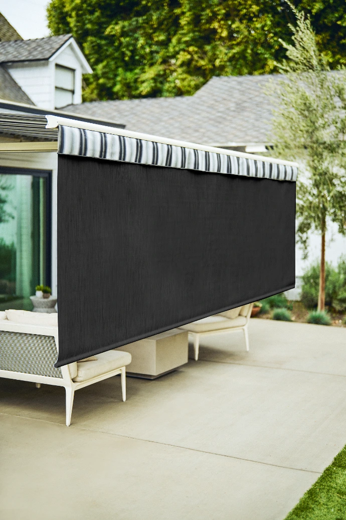 Awning with a lowered front drop screen for additional shade and privacy